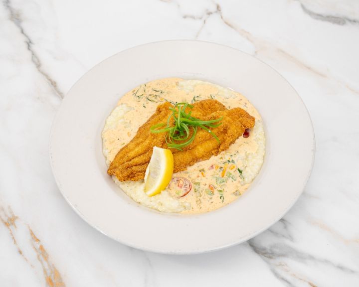 Golden fried catfish over creamy grits