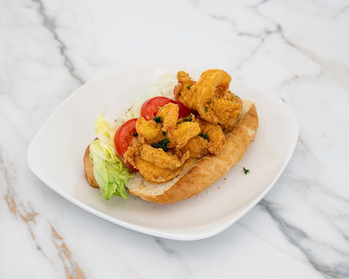Fried shrimp po'boy with lettuce and tomato